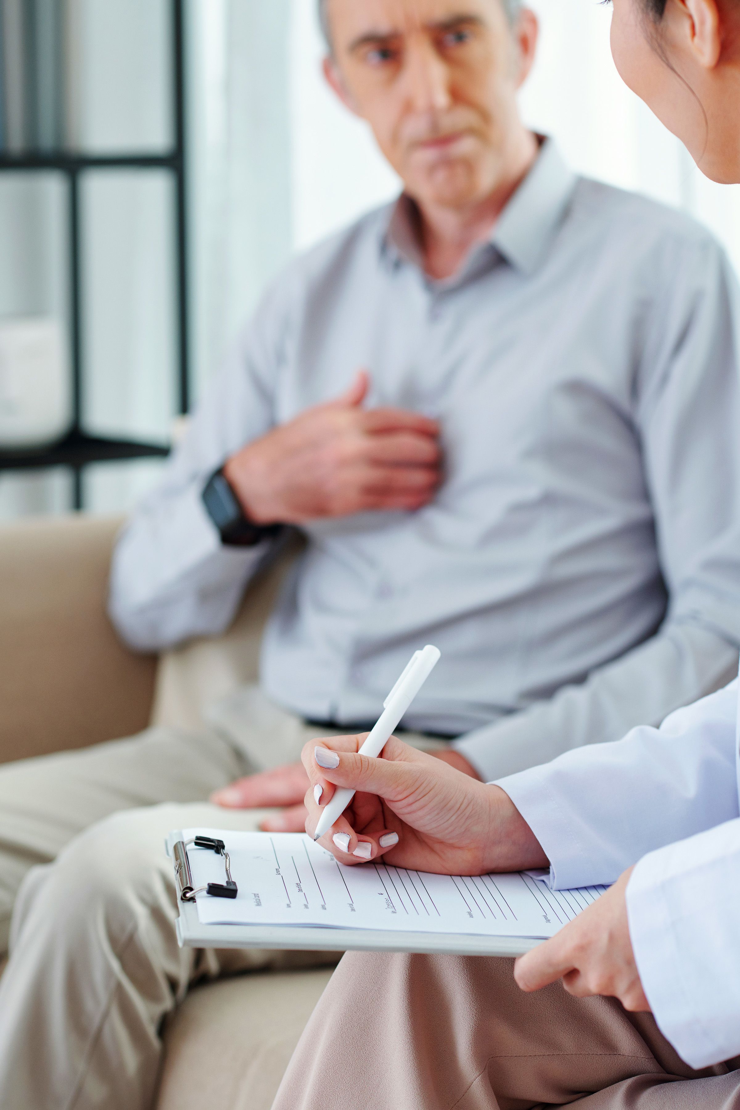 Photo of a man consulting with a doctor